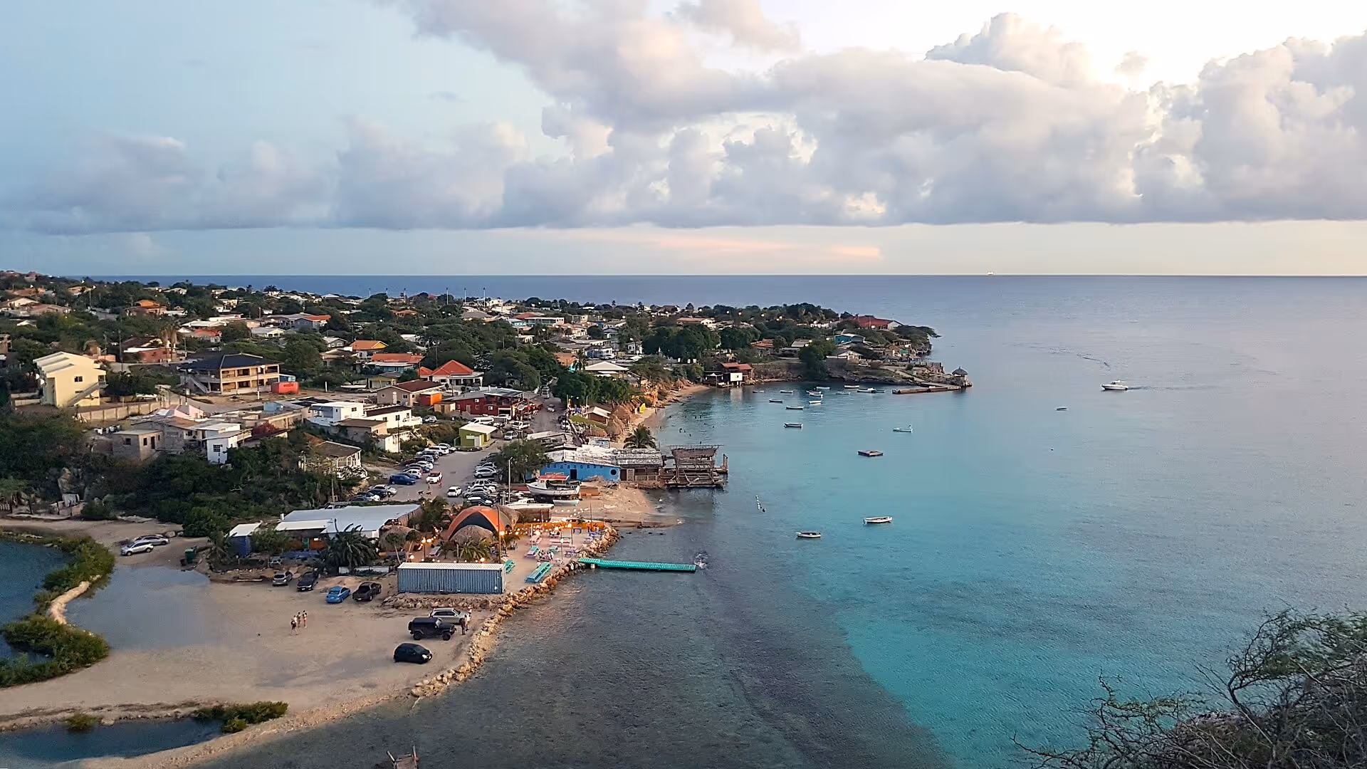 The Boca Sami fishing village and pier on Sint Michielsbaai, boats moored in the bay