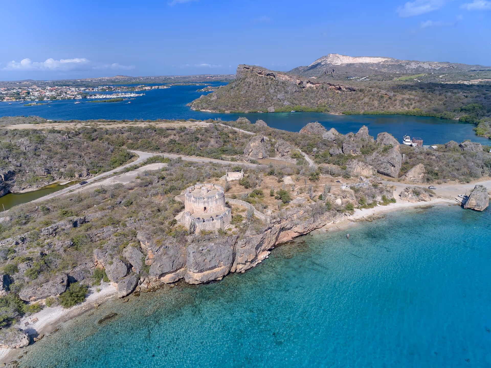 Fort Beekenburg above Caracasbaai from the air, the bay and coastline behind it